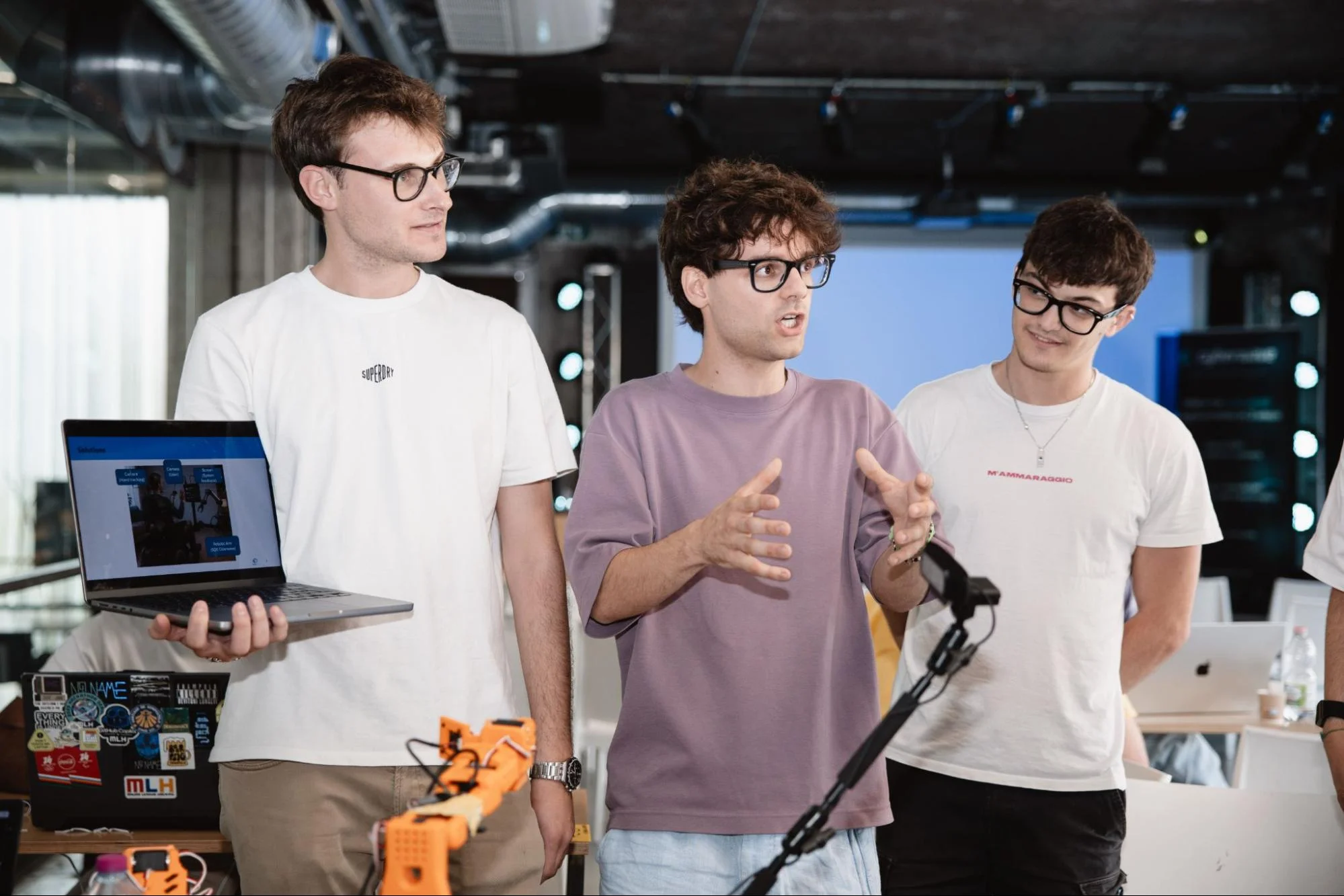 The WaveArm team presenting their demo with the robot arm